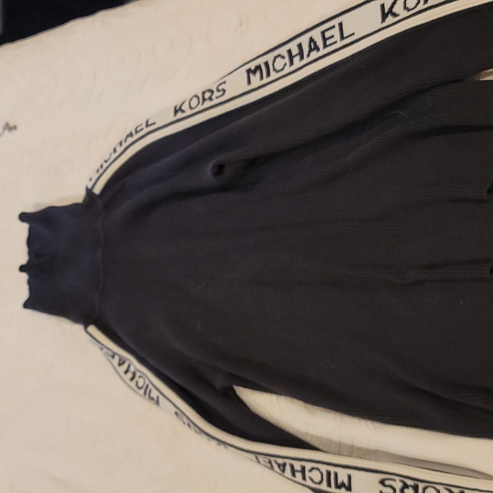 Michael Kors Black sweater, white stripes down the arms. Medium women's